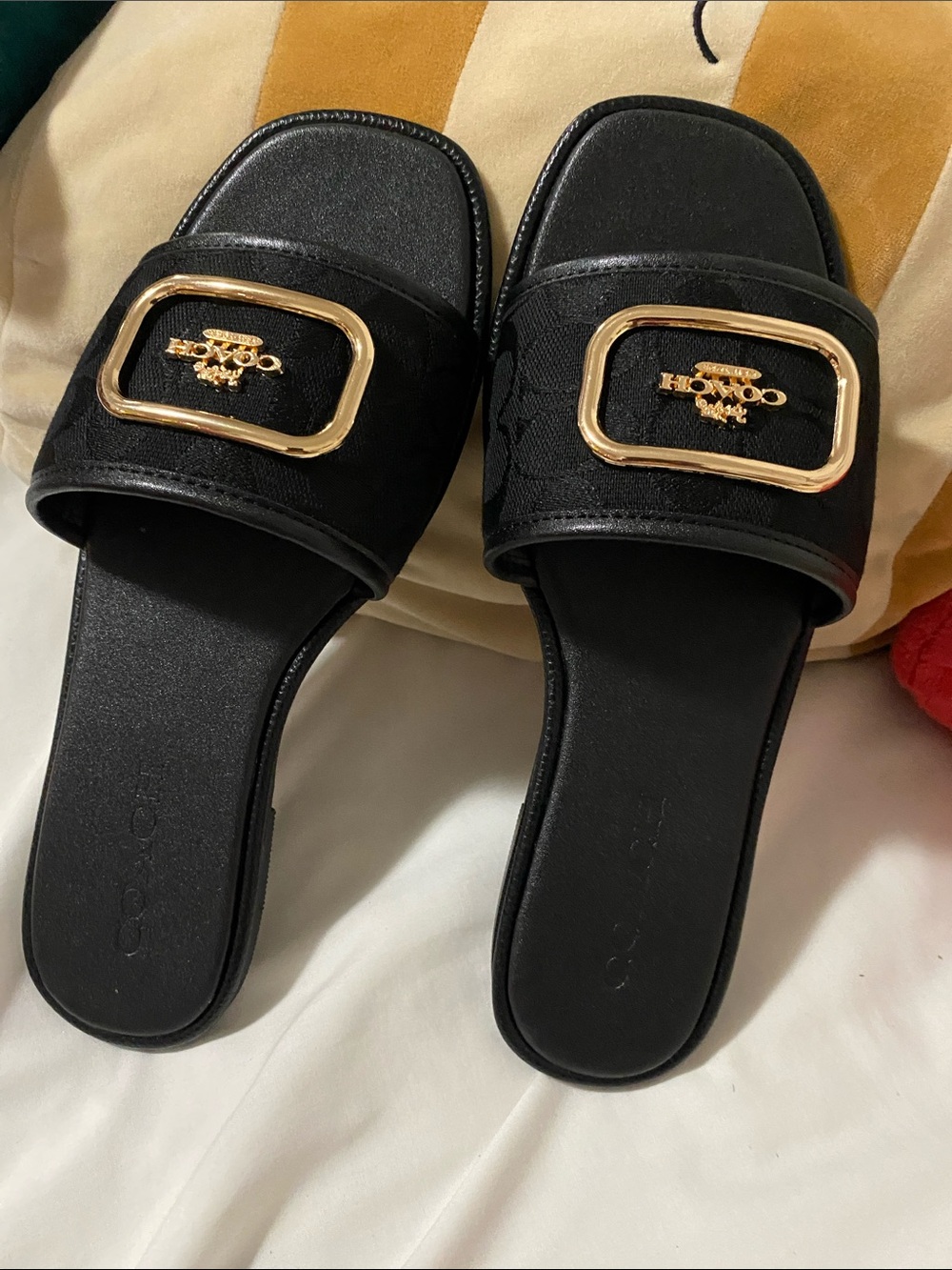 Coach Black Slide Mules with Gold Buckle Emblem